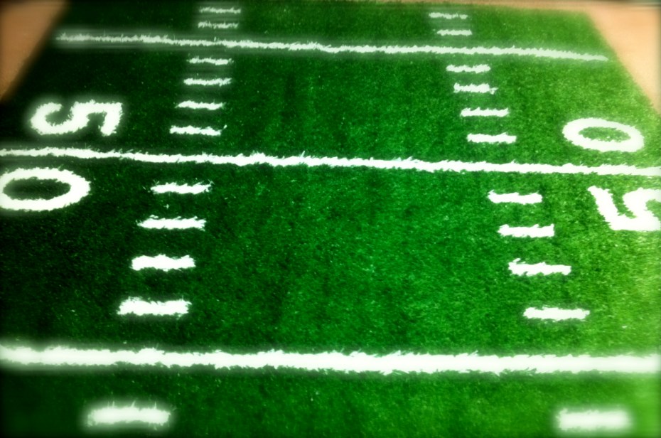 2 inch turf with hand-sewn in hash marks, lines, and numbers