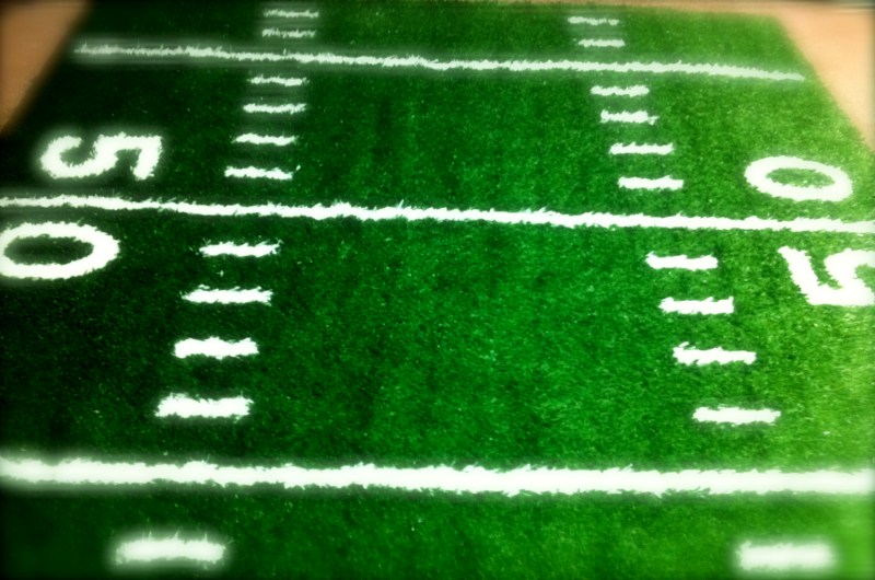 2 inch turf with hand-sewn in hash marks, lines, and numbers